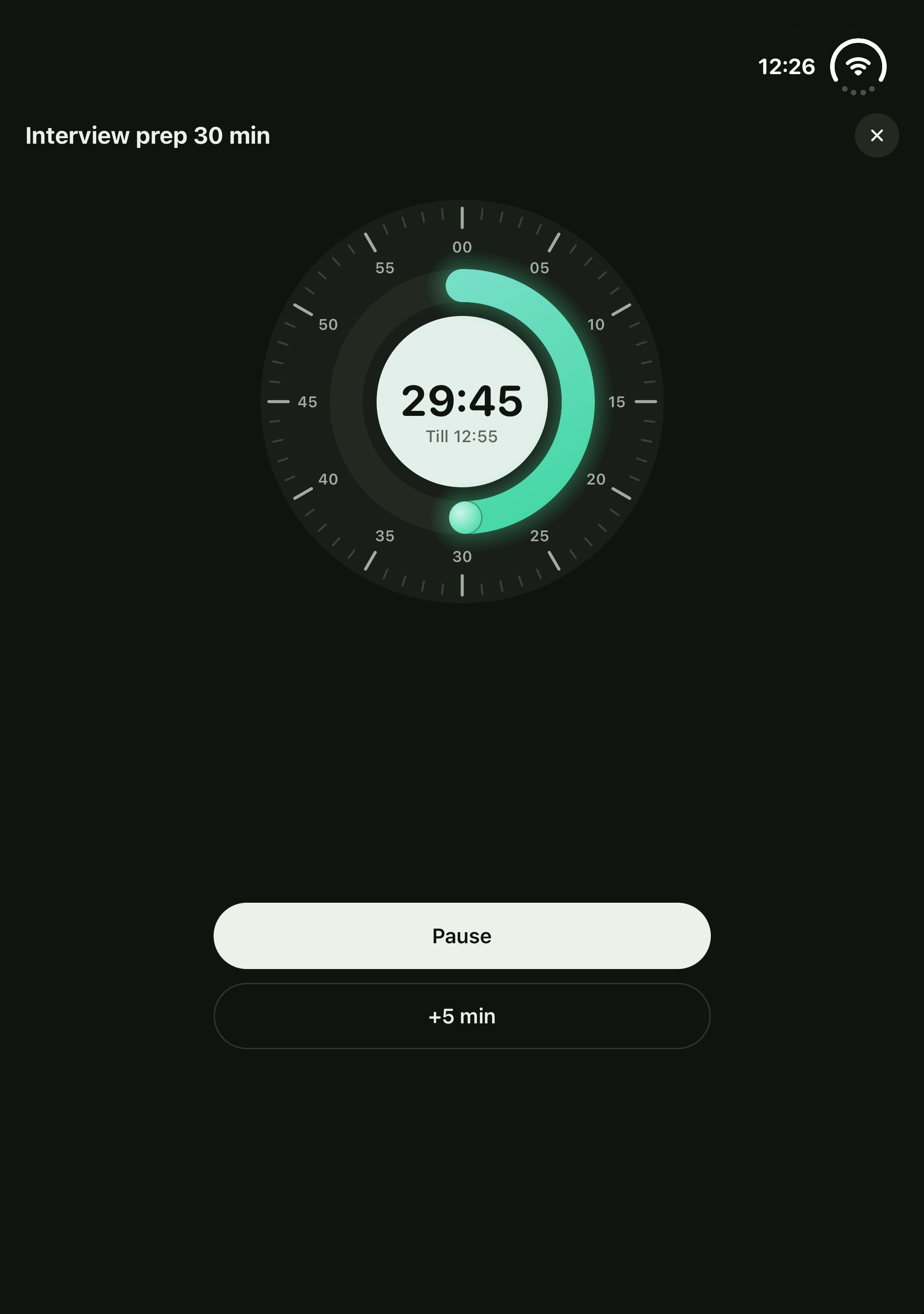 A running habit timer in tabletop pose: the clock on the top half, Pause below